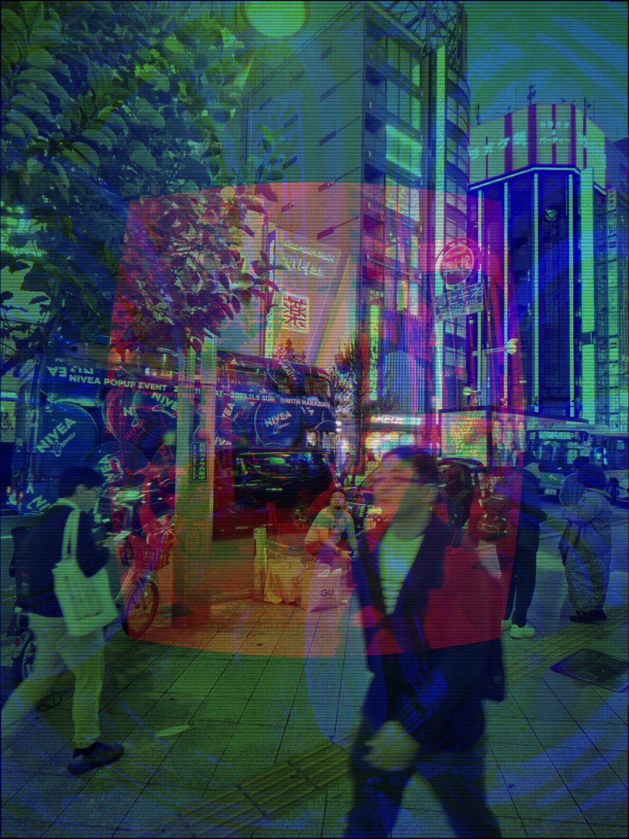A Tokyo street pushed through the CRT preset: green and magenta phosphor separation, barrel curvature bending the buildings, a visible shadow mask over everything.