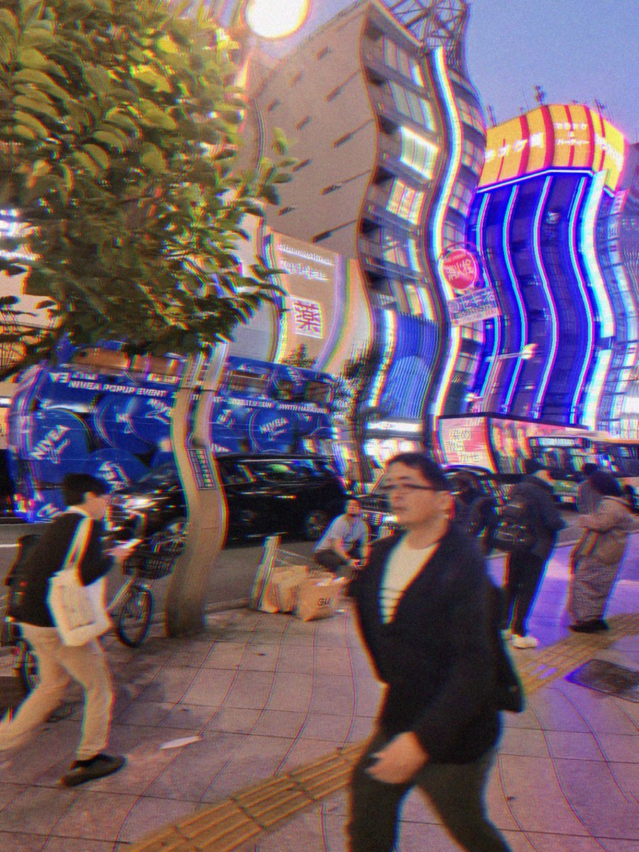 The same street through the Cyber preset: sharp red and cyan channel offset on every edge, a slow wave running through the geometry.